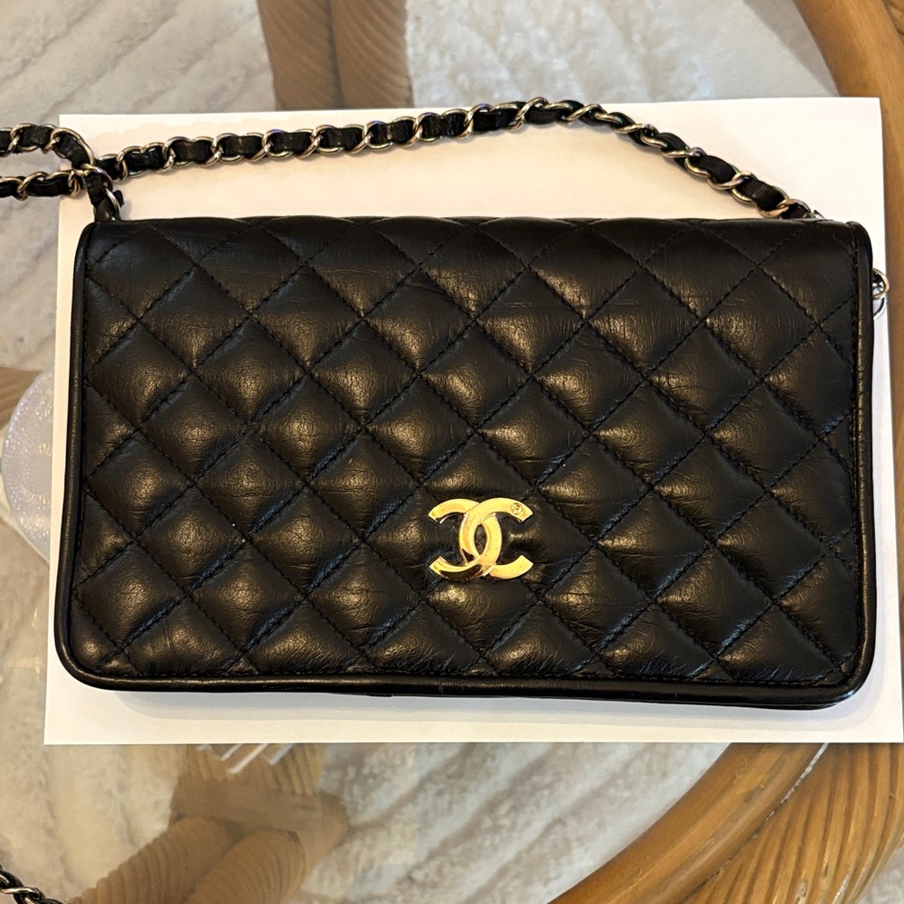 Vintage CHANEL Black Quilted Leather Clutch with Gold Accents 1990’s